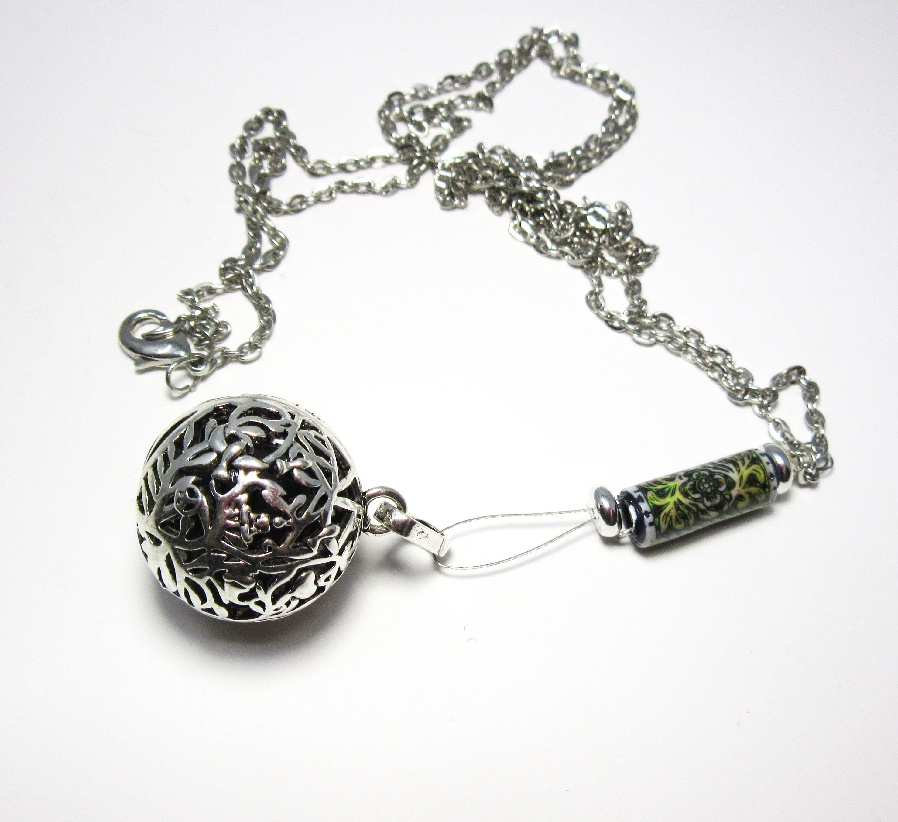 Close-up of Diffuser Necklace showcasing floral pendant and colorful lava beads, highlighting its essential oil diffuser capabilities and elegant design.