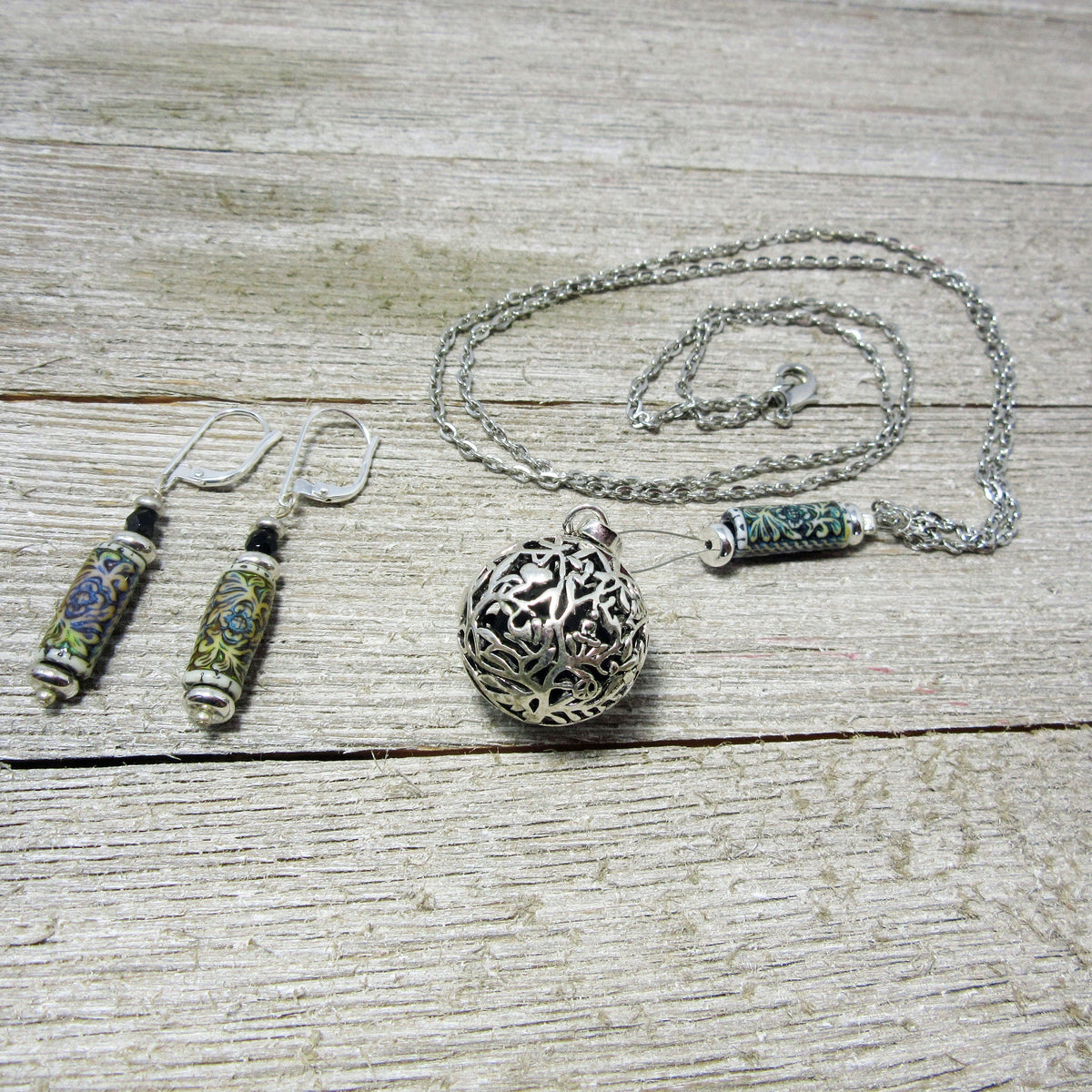 Close-up of the Diffuser Necklace showing the essential oil jewelry design with vibrant floral patterns and color-changing lava beads, a meaningful gift for her.