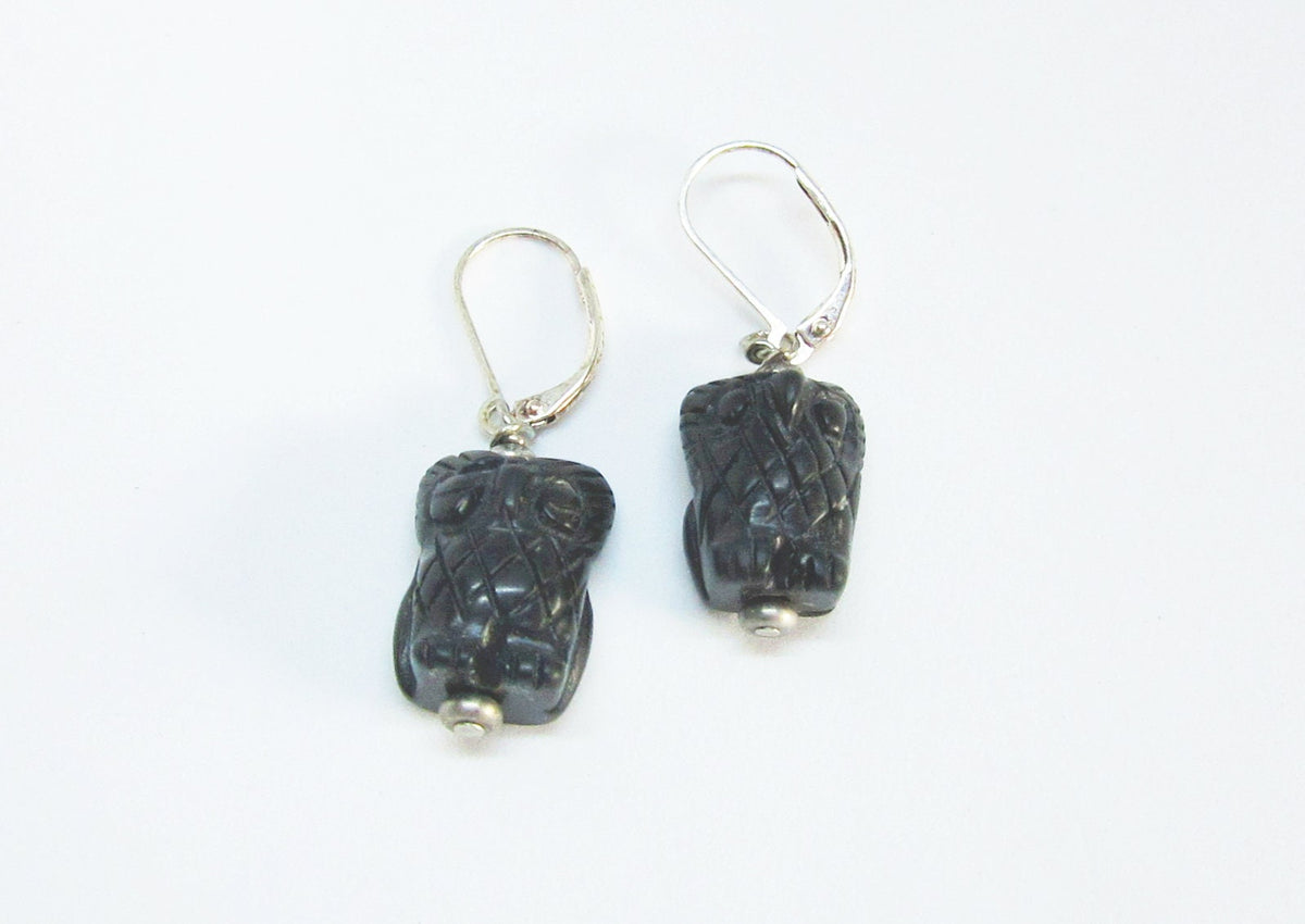 Close-up of Woodland Earrings, showcasing the intricate carvings of owl jewelry for women.
