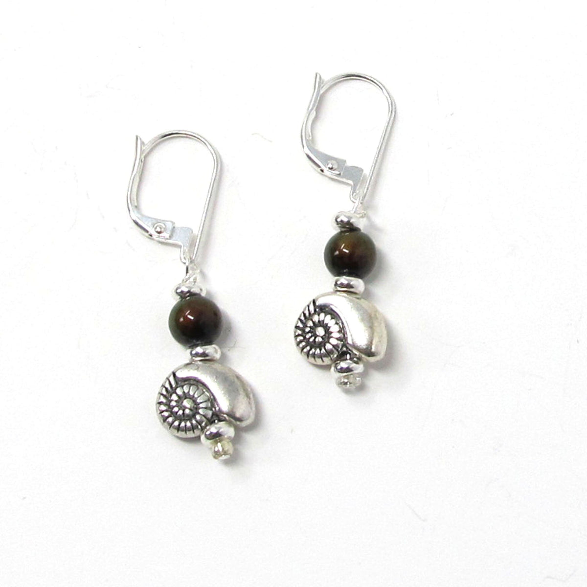 Close-up of SEA SHELL EARRINGS - Dangle shell earrings featuring a unique color change feature, ideal for beach enthusiasts and nature lovers.