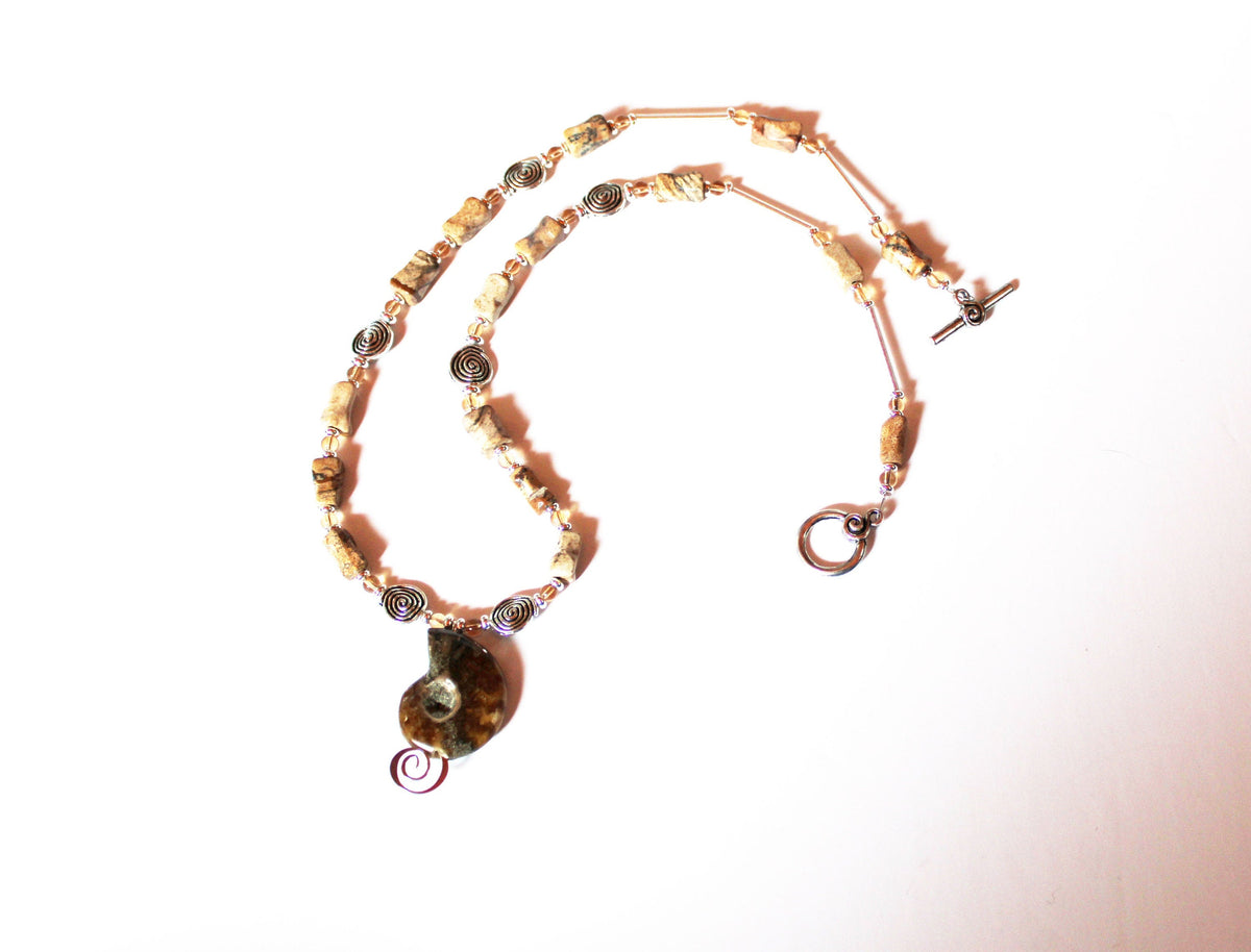 One of a kind jewelry set featuring ammonite fossils, perfect gift for couples.