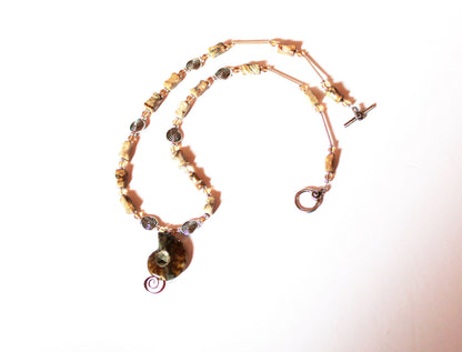 One of a kind jewelry set featuring ammonite fossils, perfect gift for couples.