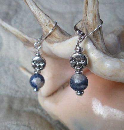 Close-up of Blue Moon Sodalite Earrings showing the intricate silver carving of the full moon atop blue sodalite, perfect for zen aesthetic and emotional balance.