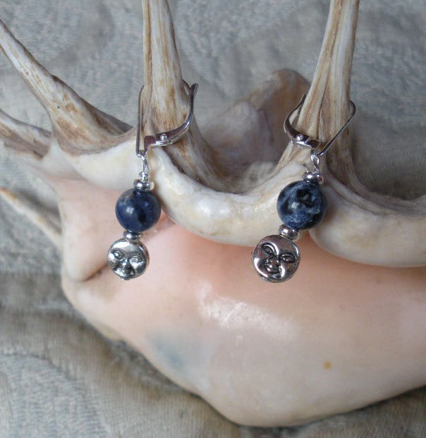 Handmade Blue Moon Sodalite Earrings highlighting the contrast between silver moons and deep blue sodalite orbs, ideal for enhancing confidence and tranquility.