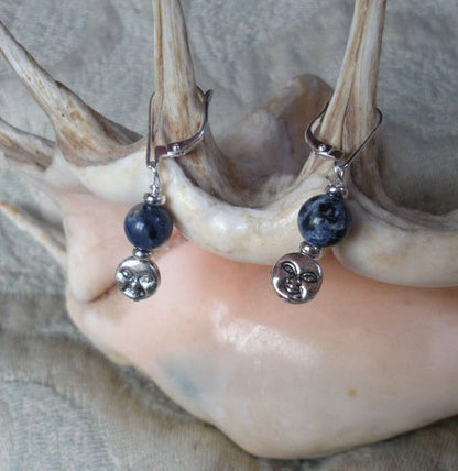 Handmade Blue Moon Sodalite Earrings highlighting the contrast between silver moons and deep blue sodalite orbs, ideal for enhancing confidence and tranquility.