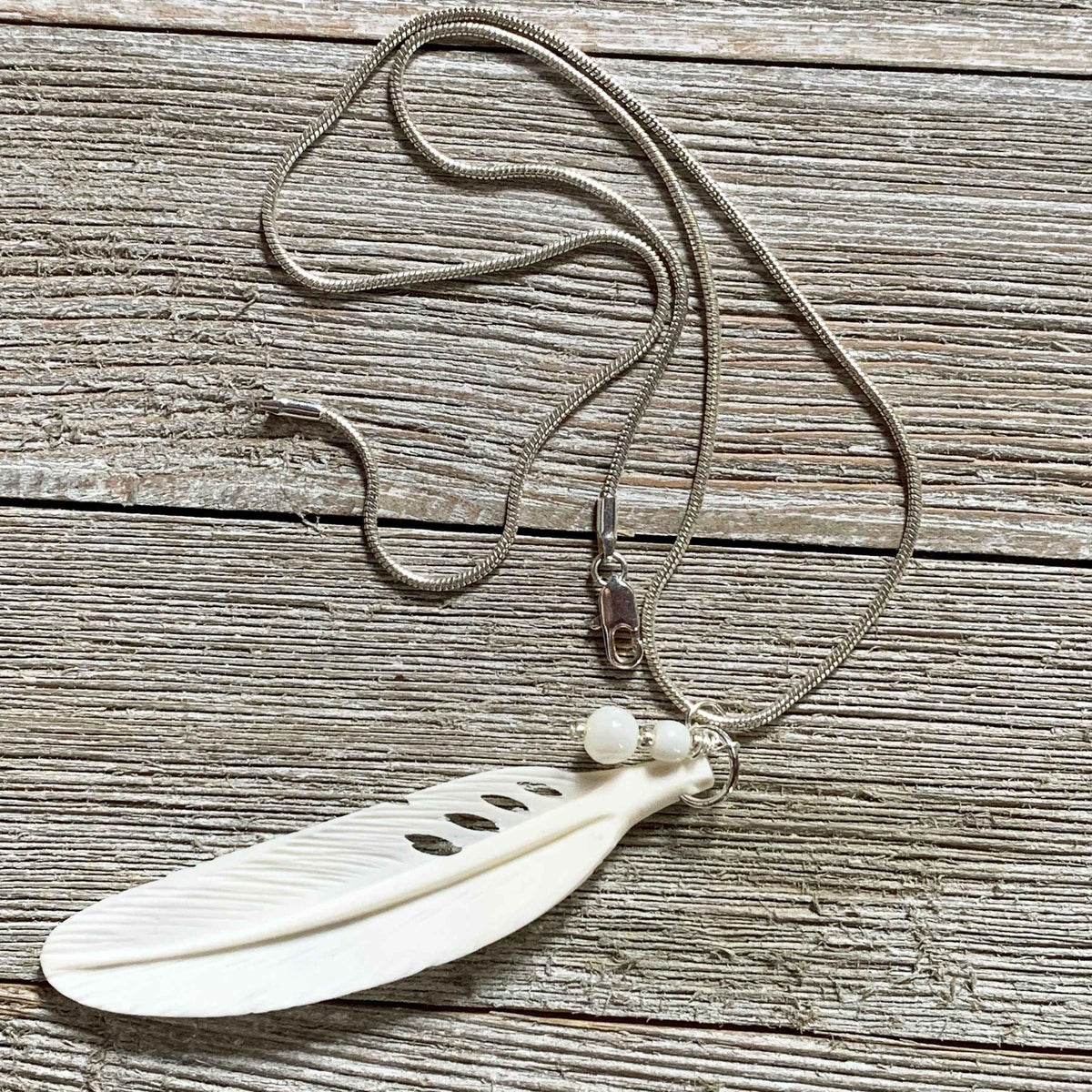 White Feather Necklace, Angel Sign White Feather Pendant featuring carved bone and mother of pearl, ideal for feminine gifts.