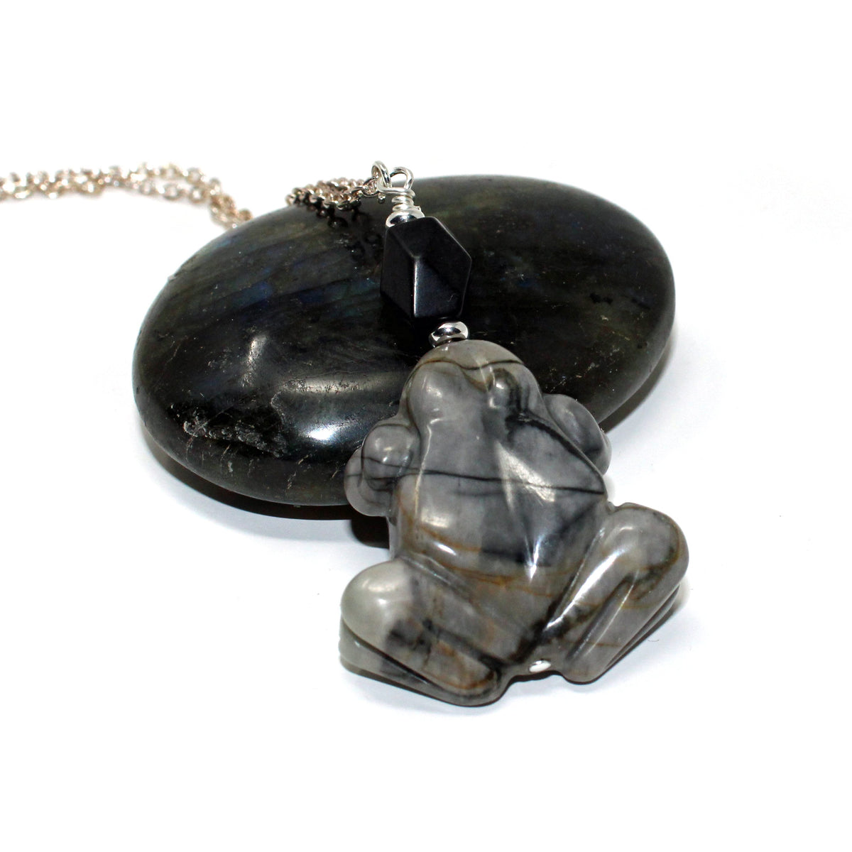 Close-up of Frog Pendant - Carved Picasso Jasper Jewelry, showcasing the intricate details and smooth finish.