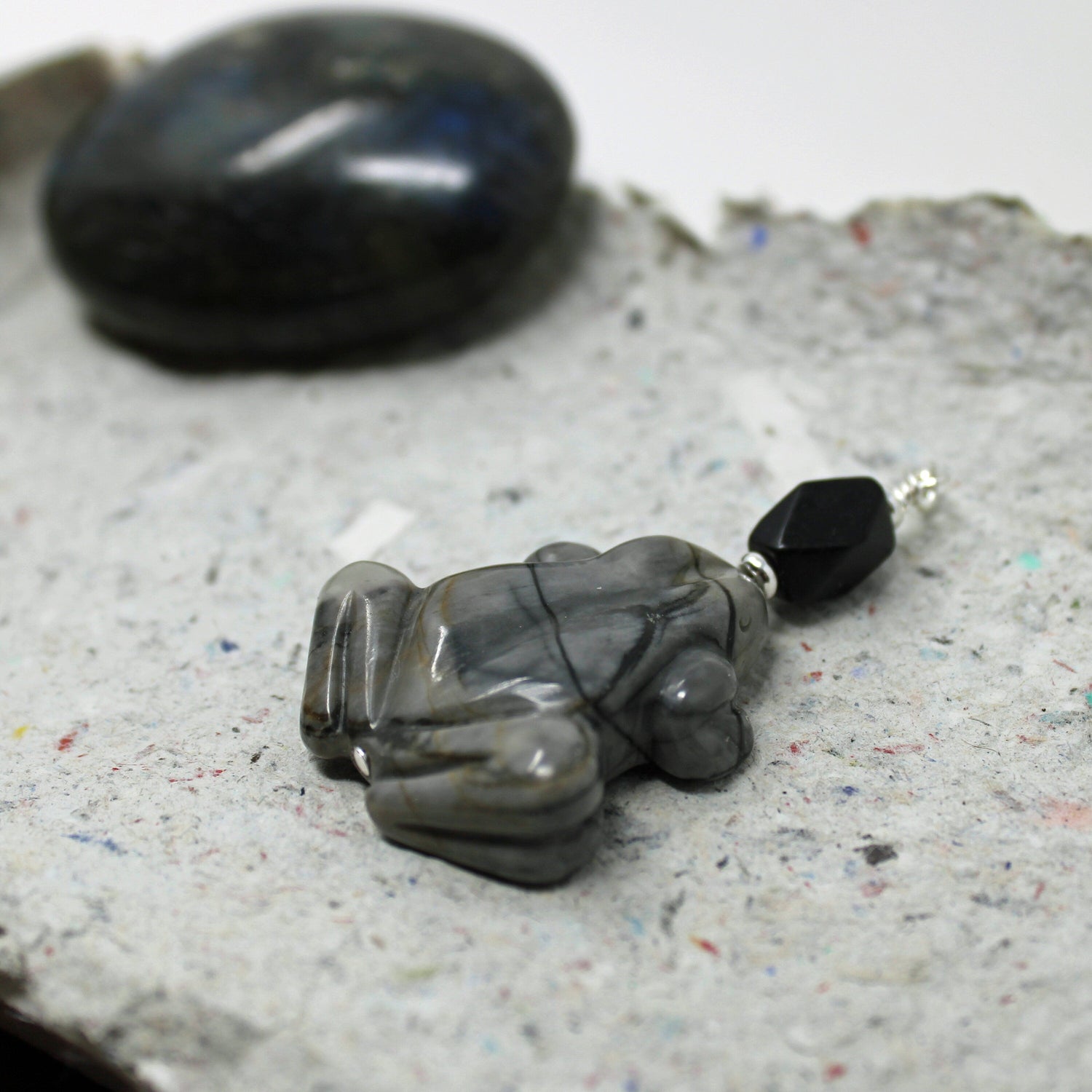 Frog Pendant - Carved Picasso Jasper Frog Jewelry displayed on a chain, ideal gift for frog lovers.