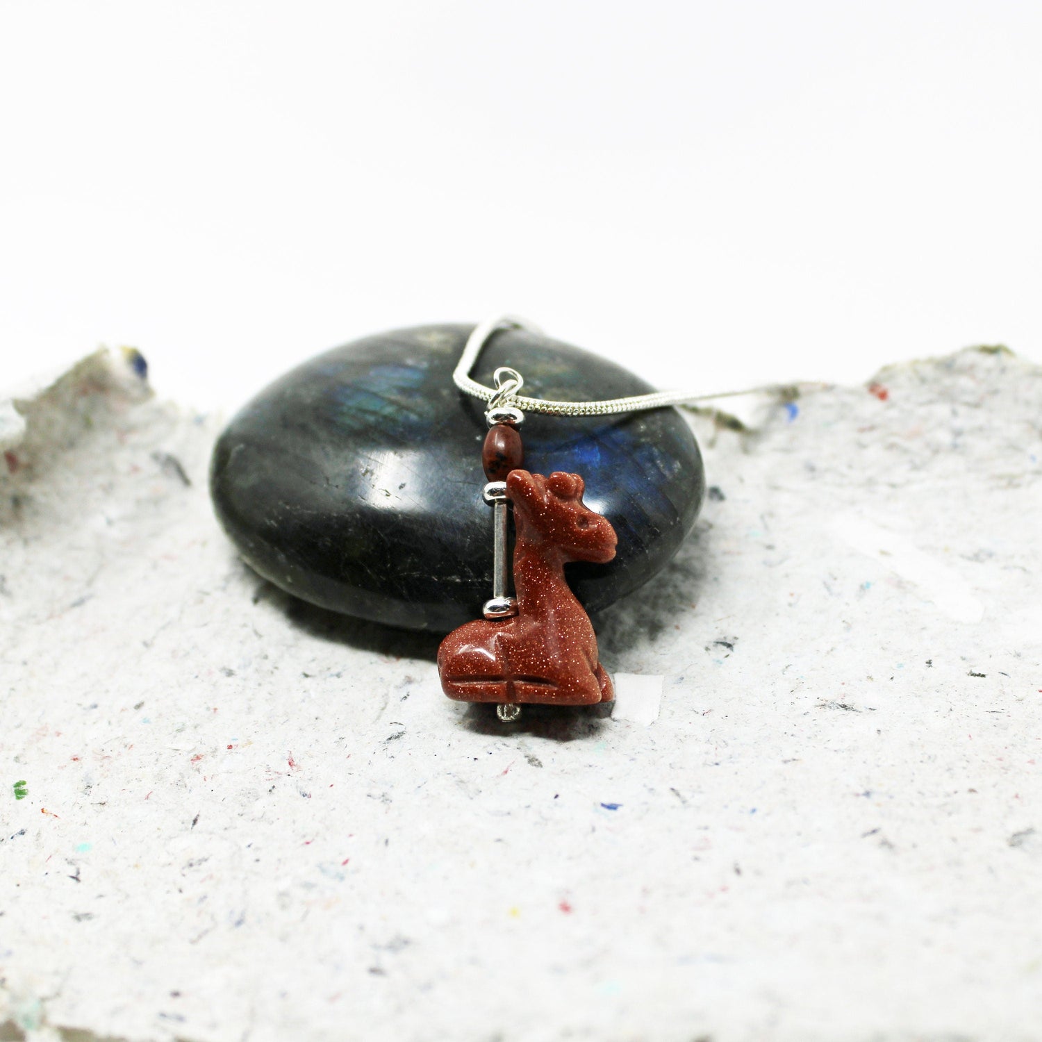 Giraffe Necklace featuring a sparkly goldstone carved animal pendant, perfect for giraffe lovers and zookeepers.