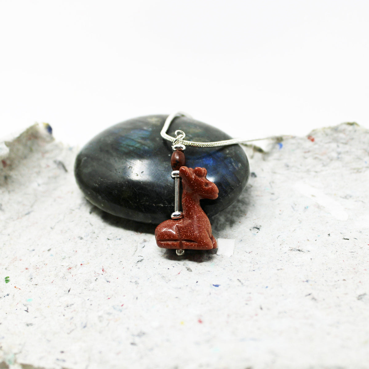 Giraffe Necklace featuring a sparkly goldstone carved animal pendant, perfect for giraffe lovers and zookeepers.
