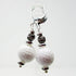 Golf Ball Lever Back Earrings: Golfer Jewelry not to tee you off—white golf ball-textured beads with silver-toned spacers and ribbed accents on lever back hooks, ideal for any golf lover.
