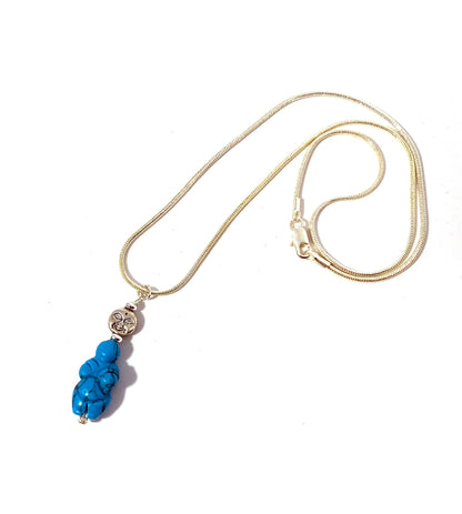 Goddess of Willendorf - Moon Priestess Turquoise Pendant showcased elegantly with a full moon in the background, perfect as spiritual jewelry and a self-love gift.