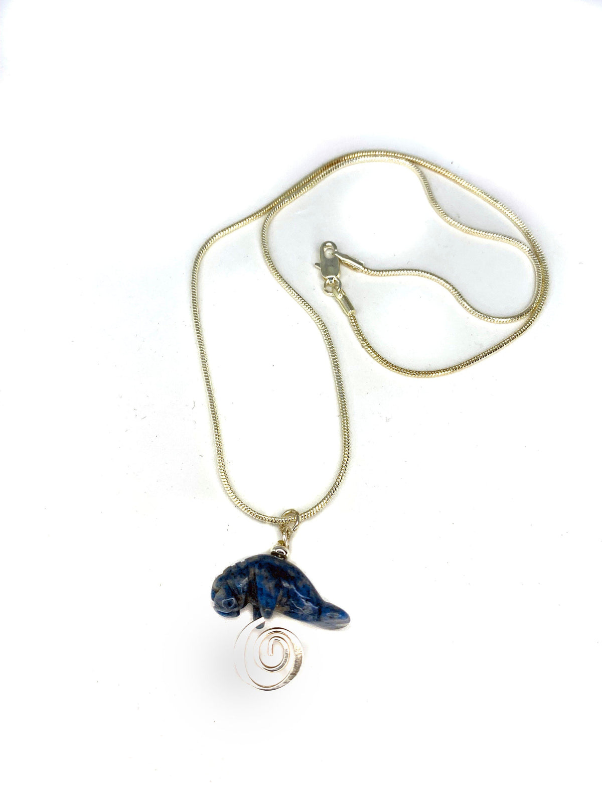 Manatee Blue Necklace featuring a carved stone sodalite pendant on a silver snake chain, perfect for beach lovers and animal gift enthusiasts.
