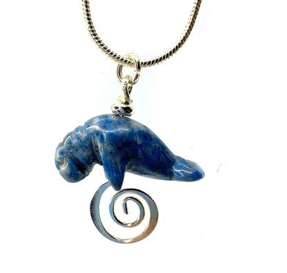 Manatee Blue Necklace with carved sodalite animal pendant, a stunning piece of jewelry representing beach lovers.