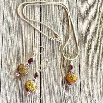 Close-up of the elegant Magic Mandala and Garnet earrings, showcasing the intricate design and mood-changing bead, ideal for healing and meditation.