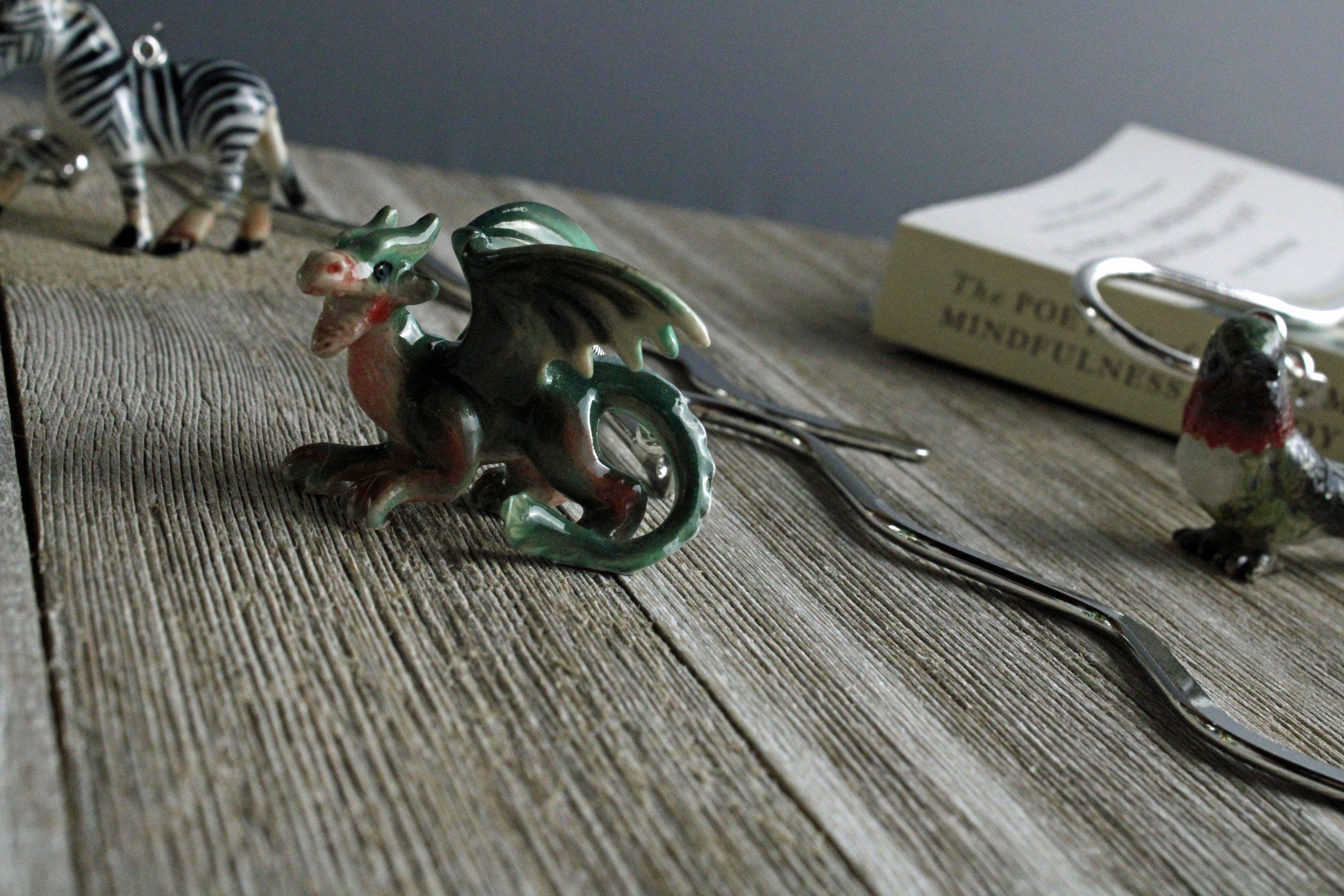 Porcelain green dragon decorative bookmark for reading; ideal mythical animal gift for a fantasy enthusiast.