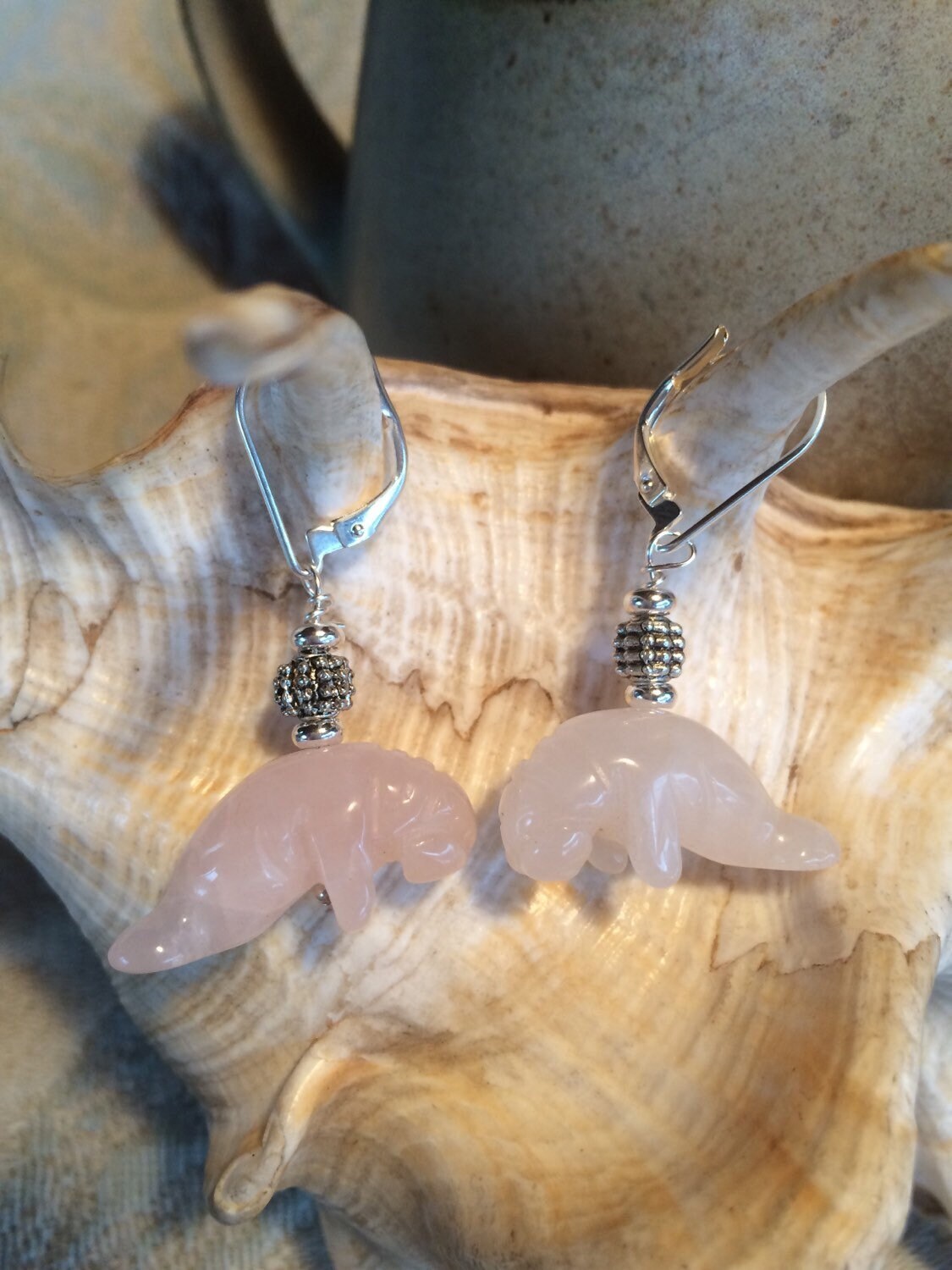 Showcasing Rose Quartz Pink Manatee Earrings - Ocean-themed drop earrings, a perfect gift for those who appreciate artisan jewelry.