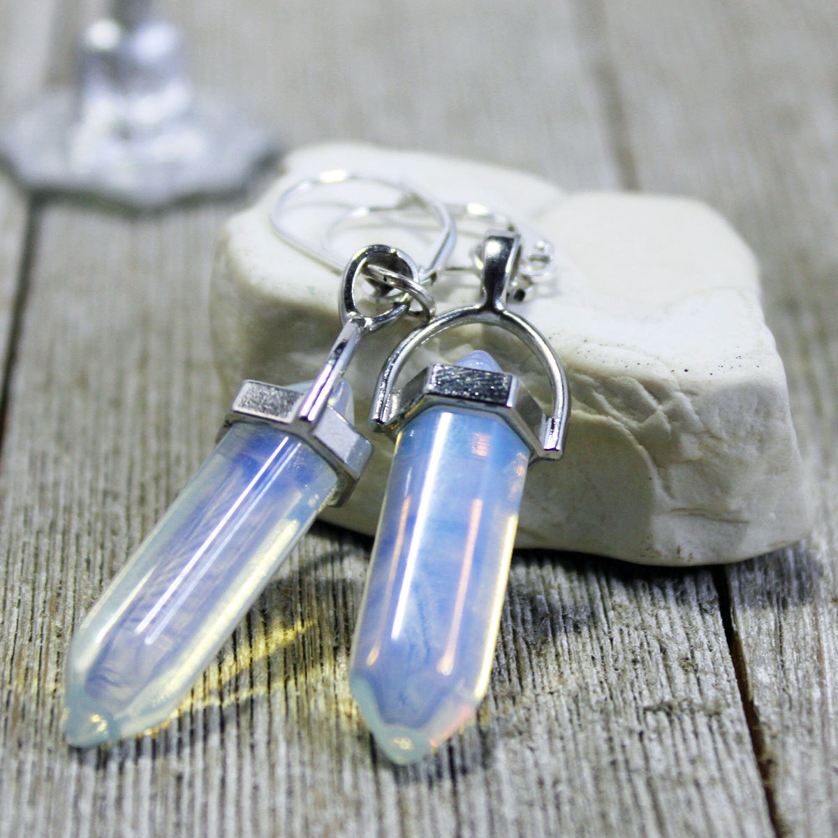 Stylish presentation of the Opalite Wand Pendant necklace and earrings set with rose quartz or moonstone base in an elegant setup.