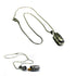 The Silver Prayer Box Necklace features a cylindrical pendant with a secret chamber for small notes or essential oils. This Zen jewelry piece, engraved and set against a white background, is perfect as unique meditation jewelry.