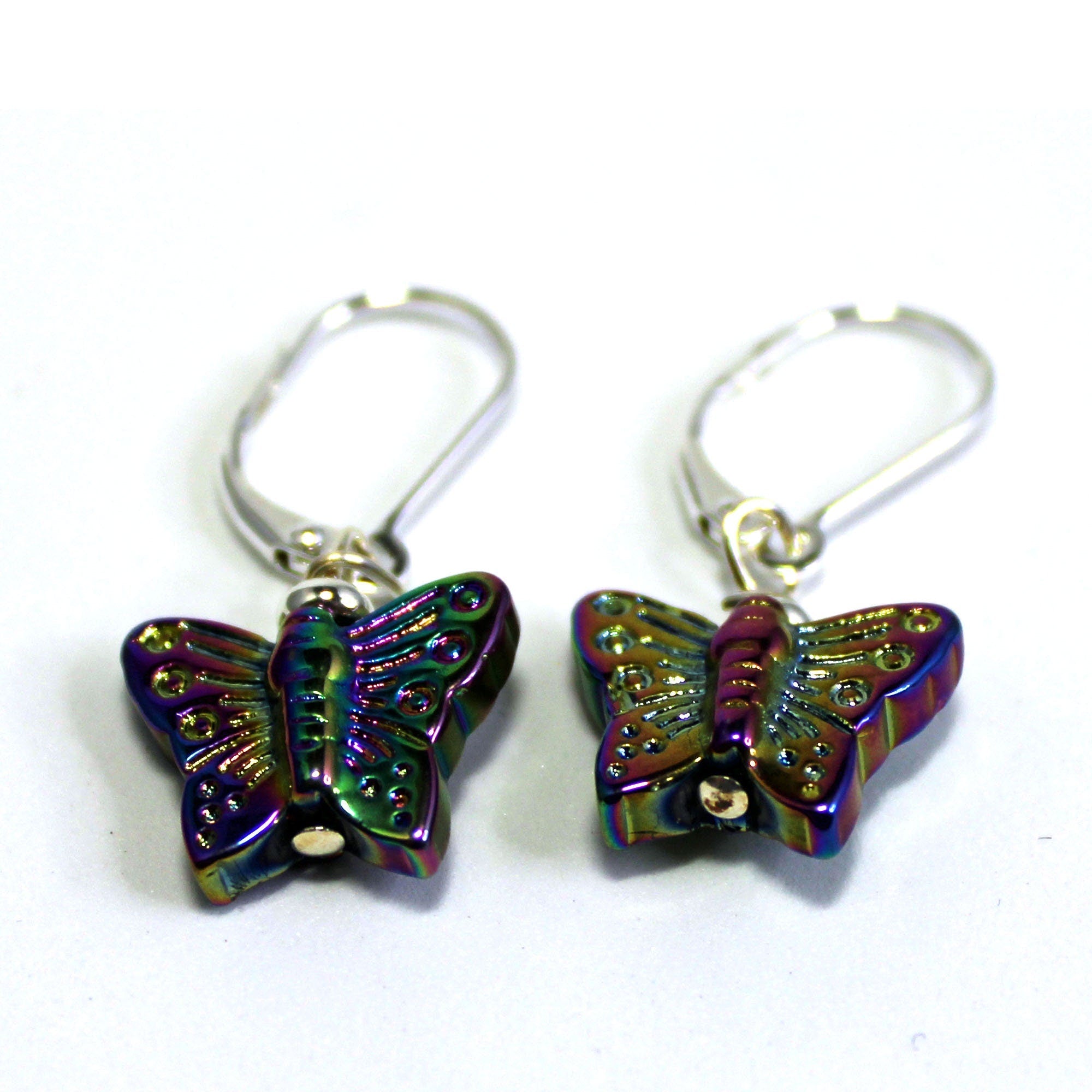 Delicate crystal butterfly earrings on a model, showcasing the shimmery design - a perfect gift for her.