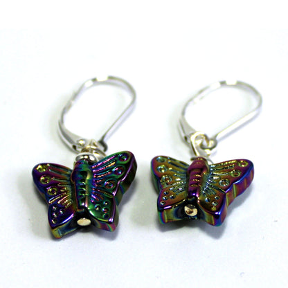 Delicate crystal butterfly earrings on a model, showcasing the shimmery design - a perfect gift for her.