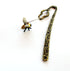 Buzzing Bee Porcelain Bookmark featuring a bronze floral base, perfect gift for bee lovers and apiculturists, stylish place marker for books.