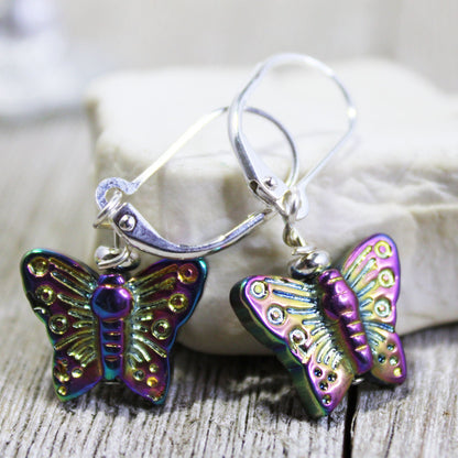 Close-up of crystal butterfly earrings featuring Aurora Borealis finish - woodland jewelry gift for butterfly lovers.