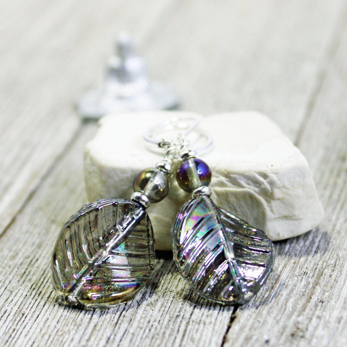 Crystal Leaf Earrings showcasing art glass aurora borealis with a shimmering AB finish in gray and pastel tones. Perfect nature aesthetic gift.