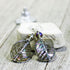 Crystal Leaf Earrings showcasing art glass aurora borealis with a shimmering AB finish in gray and pastel tones. Perfect nature aesthetic gift.