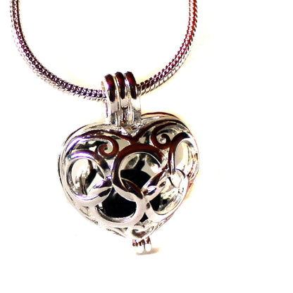 Detailed view of HEART AROMATHERAPY necklace showcasing the lotus flower design, essential oil jewelry crafted for wellness and tranquility.