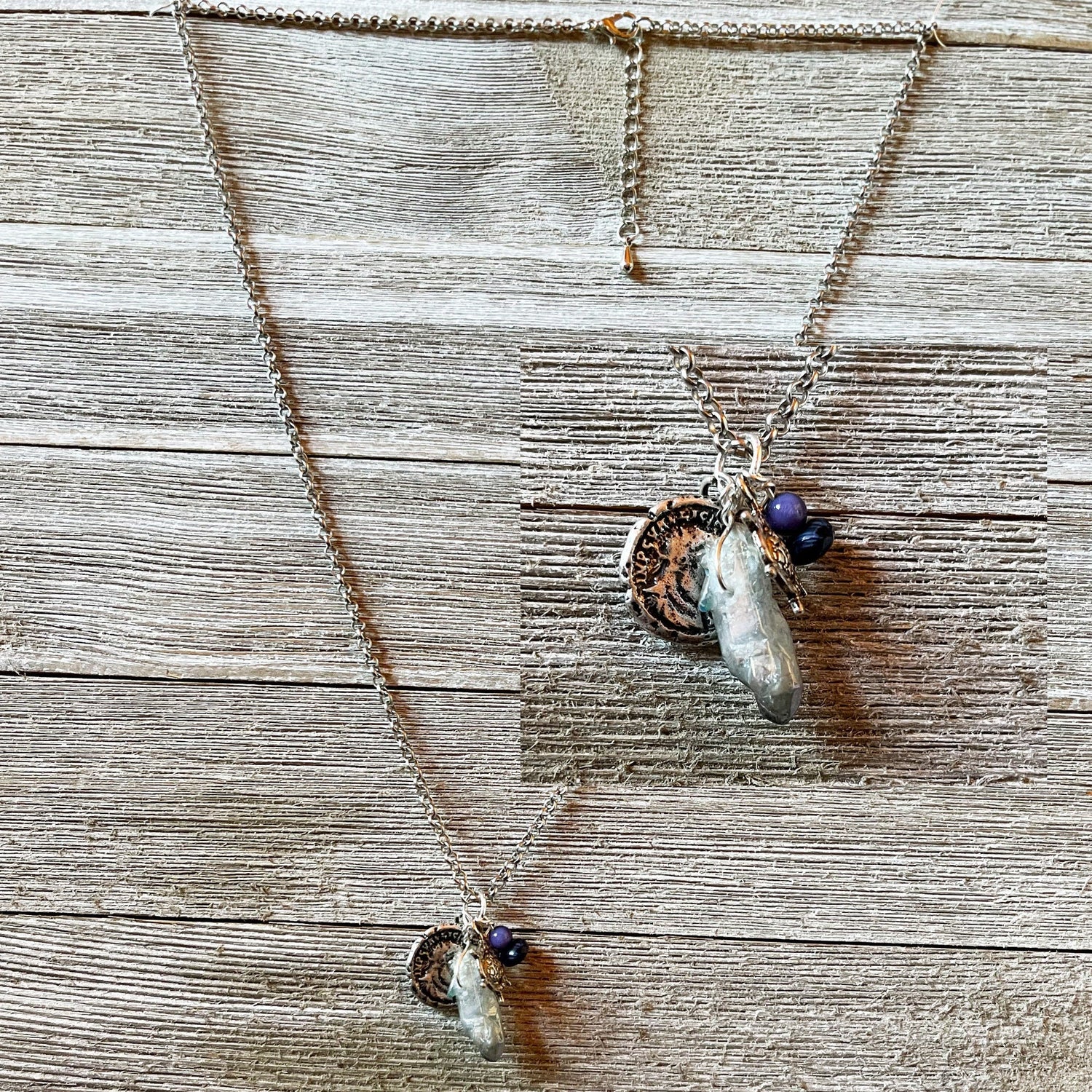 Close-up of the Pirate’s Booty Charm Necklace showcasing its shimmering silver design and unique nautical treasures.