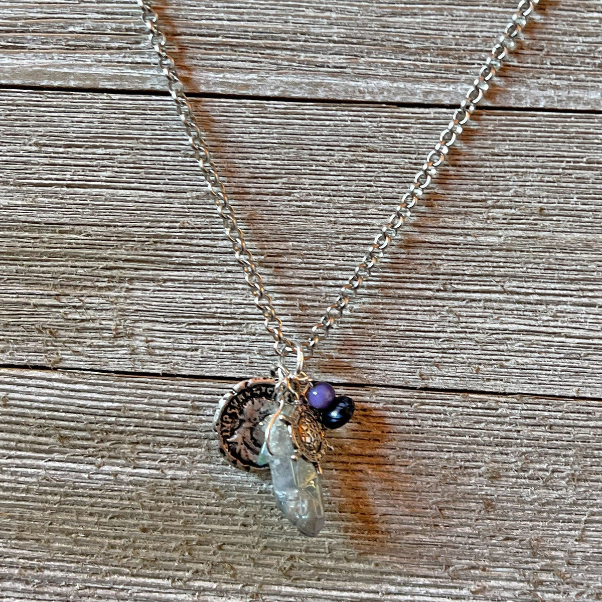 Elegant display of the Pirate’s Booty Charm Necklace, a perfect gift with pirate-themed treasures for nautical lovers.