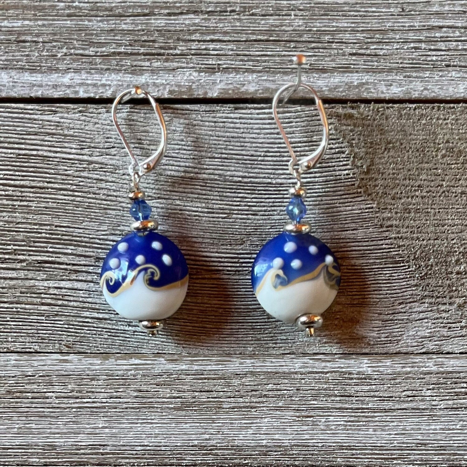 Ocean Wave Earrings say Hello - beautiful lamp worked glass earrings designed for ocean lovers, featuring blue and white swirls that mimic the ocean.