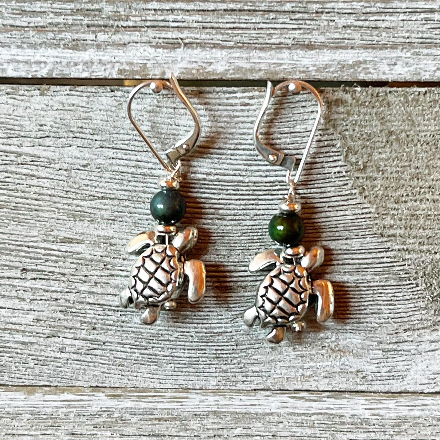 Stylish Sea Turtle Earrings displayed in a gift box, perfect for ocean lovers.