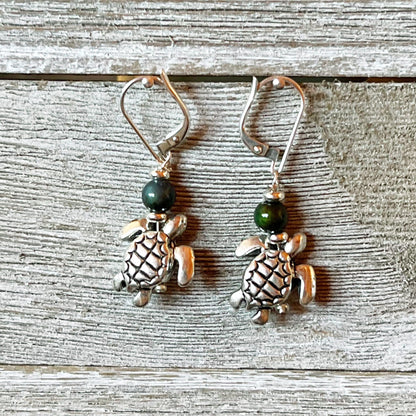Stylish Sea Turtle Earrings displayed in a gift box, perfect for ocean lovers.