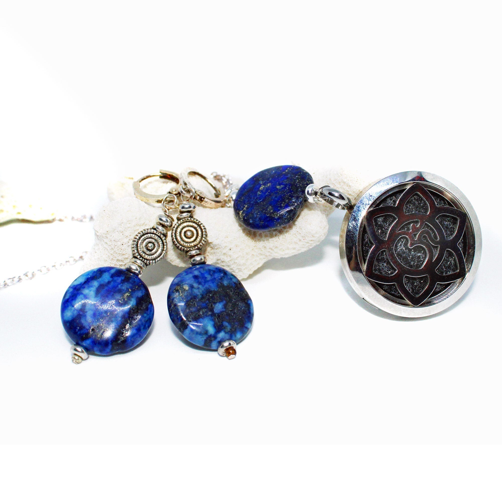 A Lapis Lazuli Jewelry Set featuring circular disc earrings with silver accents and a round lotus pendant, available separately or as a set, displayed on a light background.
