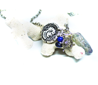 Pirate’s Booty Charm Necklace featuring gemstones, coin doubloons, crystals, and a ship&