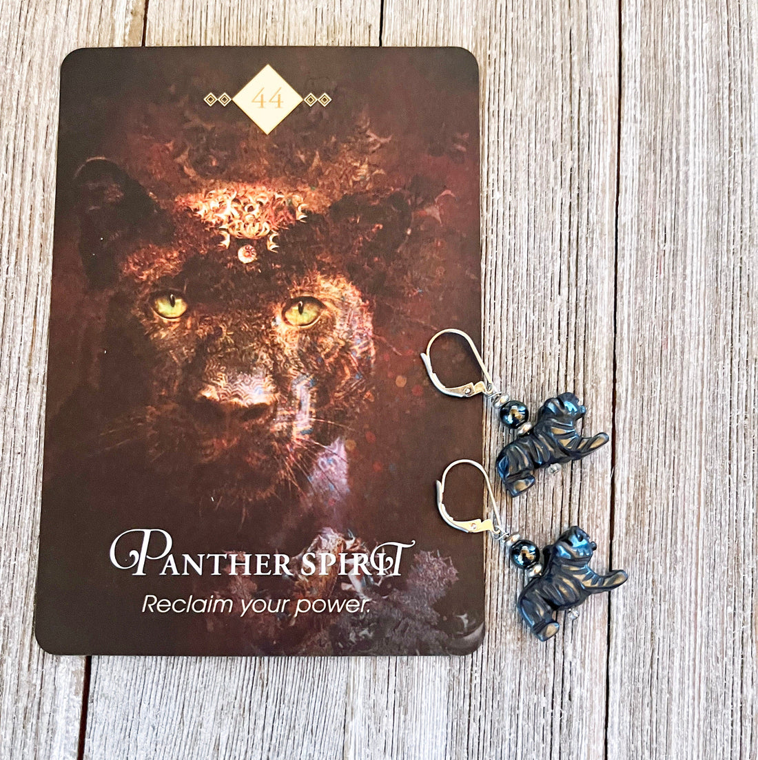 Black Panther Earrings made from carved hematite, perfect gift for big cat lovers, showcasing intricate animal jewelry design.