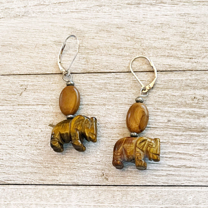 Handcrafted elephant earrings featuring carved tiger&