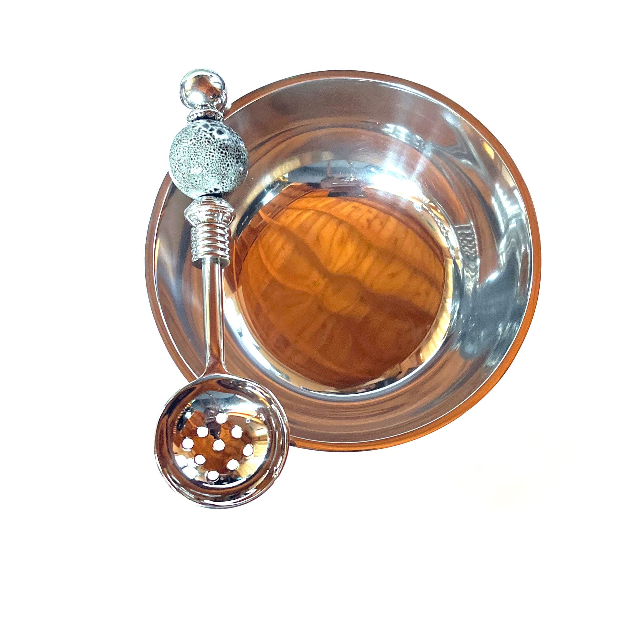Close-up of the Modern Stainless Steel Bowl Set showcasing the gray globe ceramic legs and matching spoon.