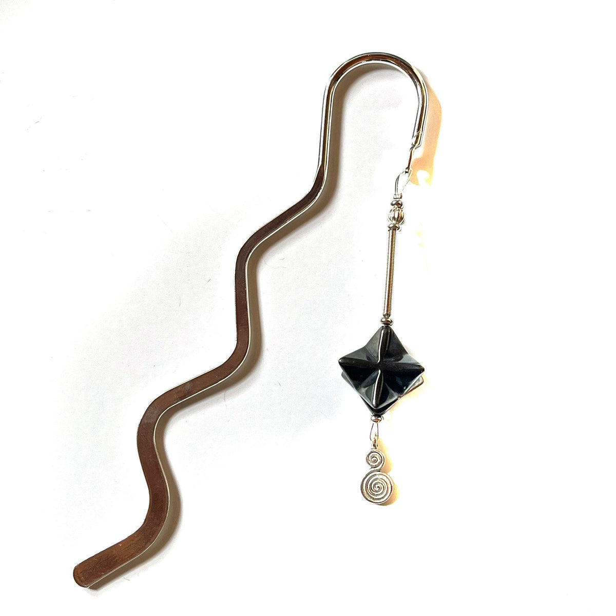 Sacred Geometry Merkaba Bookmark with Hematite showcasing its intricate design, perfect for readers seeking energy balance.