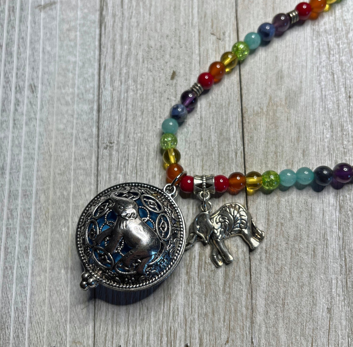 Aromatherapy Jewelry for Zen and Relaxation - Rainbow Quartz Mala Essential Oil Diffuser Necklace with Elephant locket, perfect for self-care.