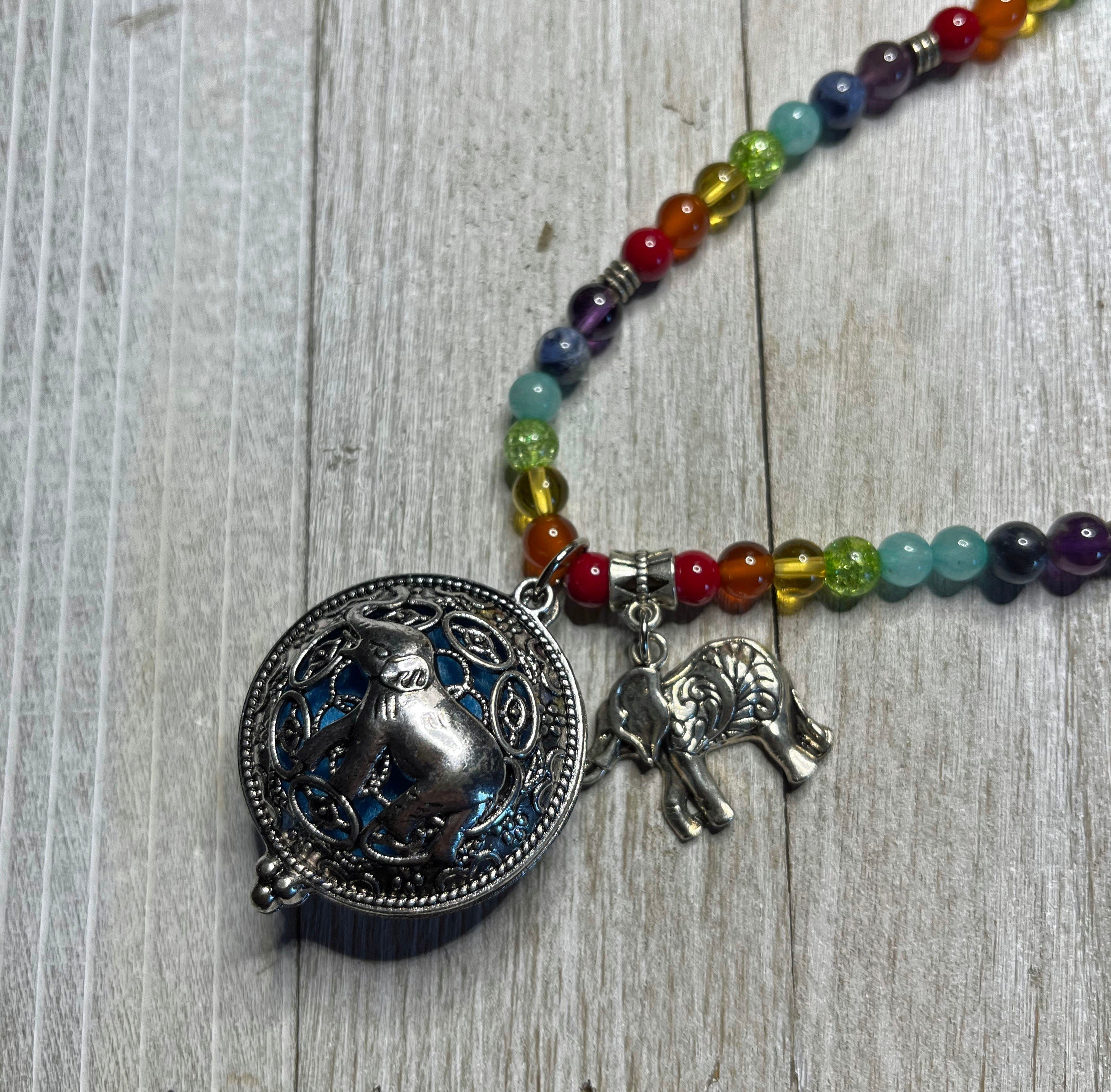 Aromatherapy Jewelry for Zen and Relaxation - Rainbow Quartz Mala Essential Oil Diffuser Necklace with Elephant locket, perfect for self-care.