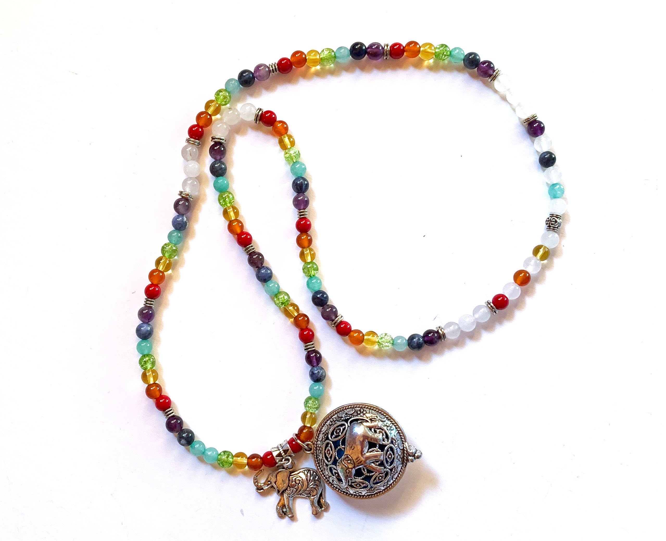 Aromatherapy Jewelry for Zen and Relaxation - Rainbow Quartz Mala Necklace displayed on a soft background, showcasing its vibrant colors.