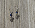 Crab Dangle Earrings – Color Changing Mood Bead, the perfect ocean lover gift, displayed on a rustic wooden surface.