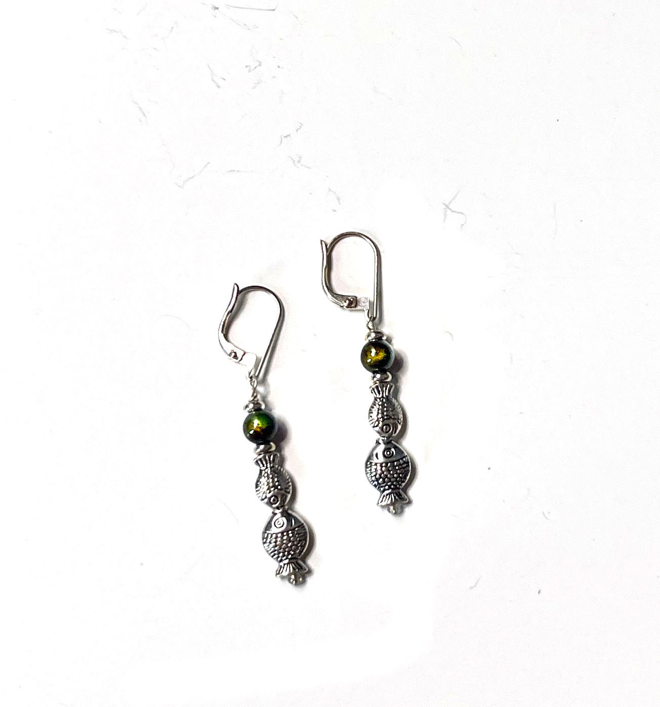 Color Changing Fish Dangle Earrings displayed on a stylish background, handmade by Gwynstone, perfect for water enthusiasts.