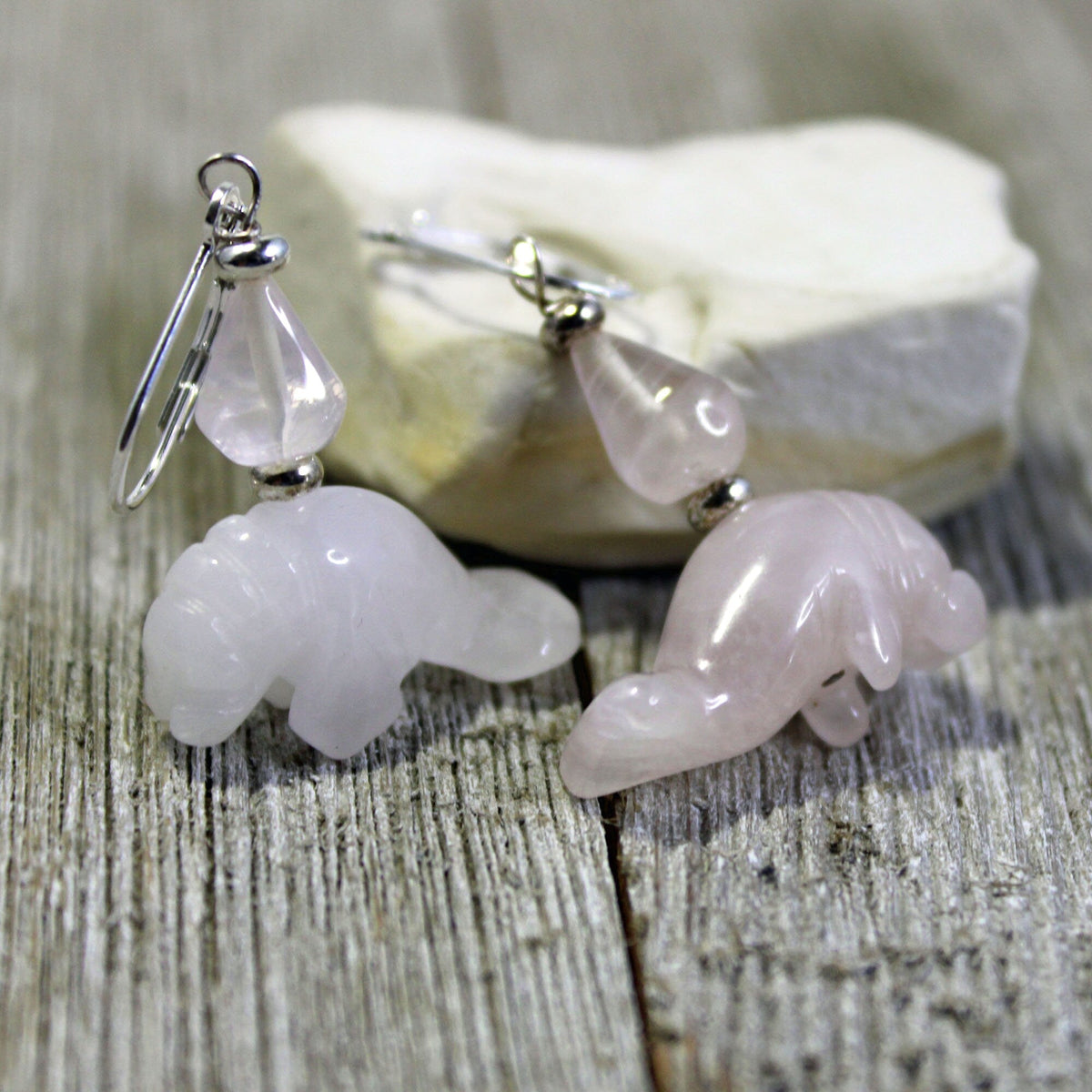 Close-up of Rose Quartz Pink Manatee Earrings - Handmade drop earrings showcasing beautiful pink rose quartz in a sea life theme.