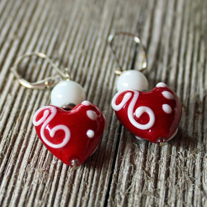 Heart Earrings - Tell her she has your heart with these stunning glass heart earrings. Featuring vibrant pink, red, and white lampwork design, these dangle earrings are a perfect statement piece for your love.