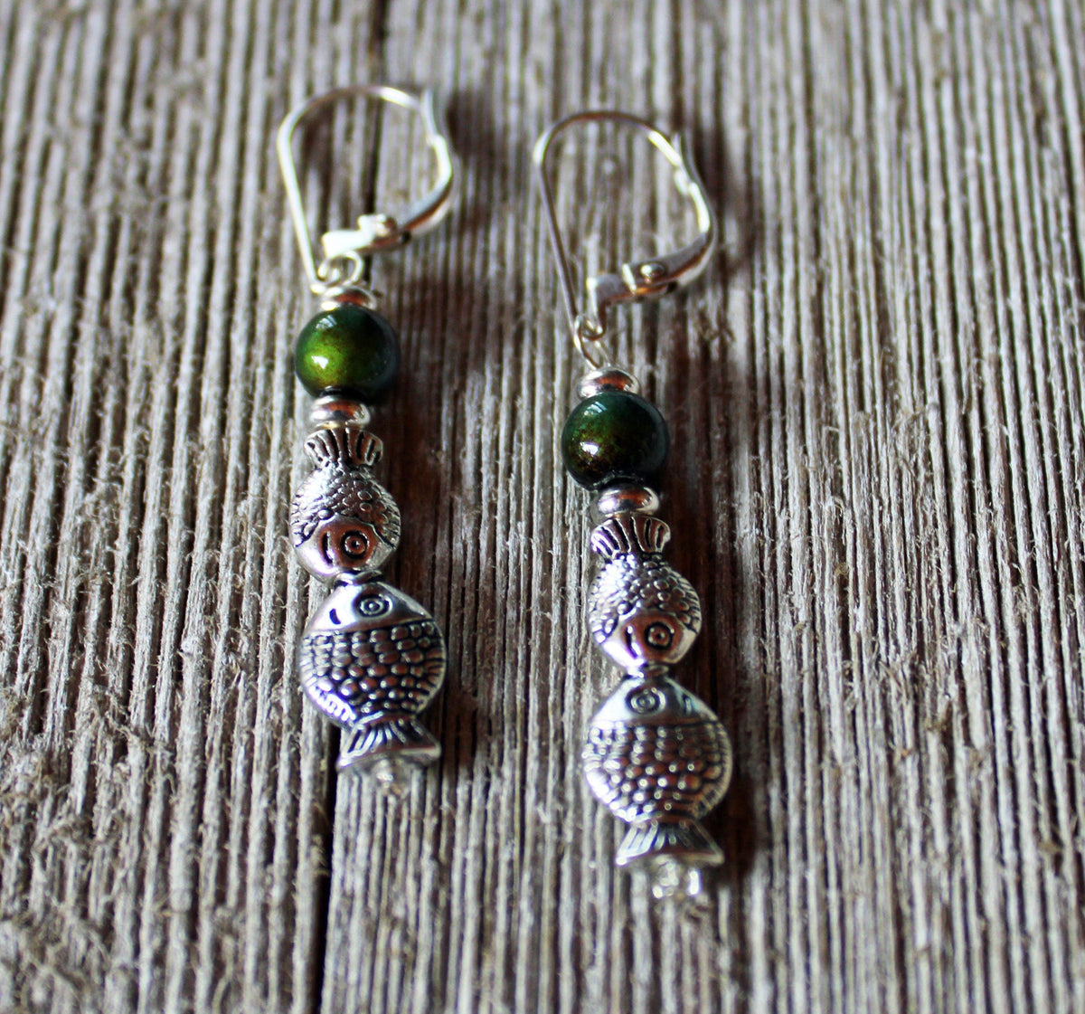 Close-up view of Color Changing Fish Dangle Earrings showcasing the unique mood bead that changes color, ideal for jewelry lovers.