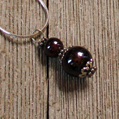 Sacred Geometry Garnet Earrings featuring intricate geometric designs on artisan handmade 925 Sterling Silver lever back earwires.